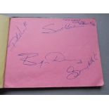 Autograph book containing the signatures of Thin Lizzy - Phil Lynott, David Essex,