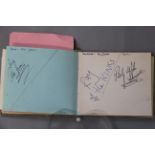 An autograph book with signatures and many car registrations of the groups collected personally by