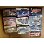 10 x plastic model kits, mostly cars by Revell and AMT,