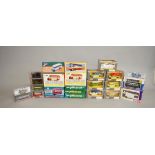 Twenty four boxed Corgi diecast models, mainly buses and coaches in various different scales,