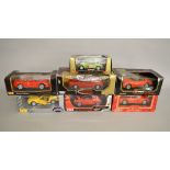 Seven 1:18 scale diecast models by Maisto, Bburago and similar, including Ferrari models. Boxed, G.