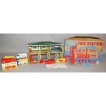 A boxed tinplate 'Mettoy Playthings' #6259 Fire Station complete with cardboard 'Practice Tower',