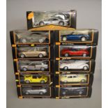 11 x Maisto 1:18 scale diecast model cars, including Jaguar and Mercedes-Benz. Boxed and VG.