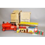 A boxed Tri-ang Pressed Steel 'Baby Puff Puff Engine' in red/black with red metal wheels and