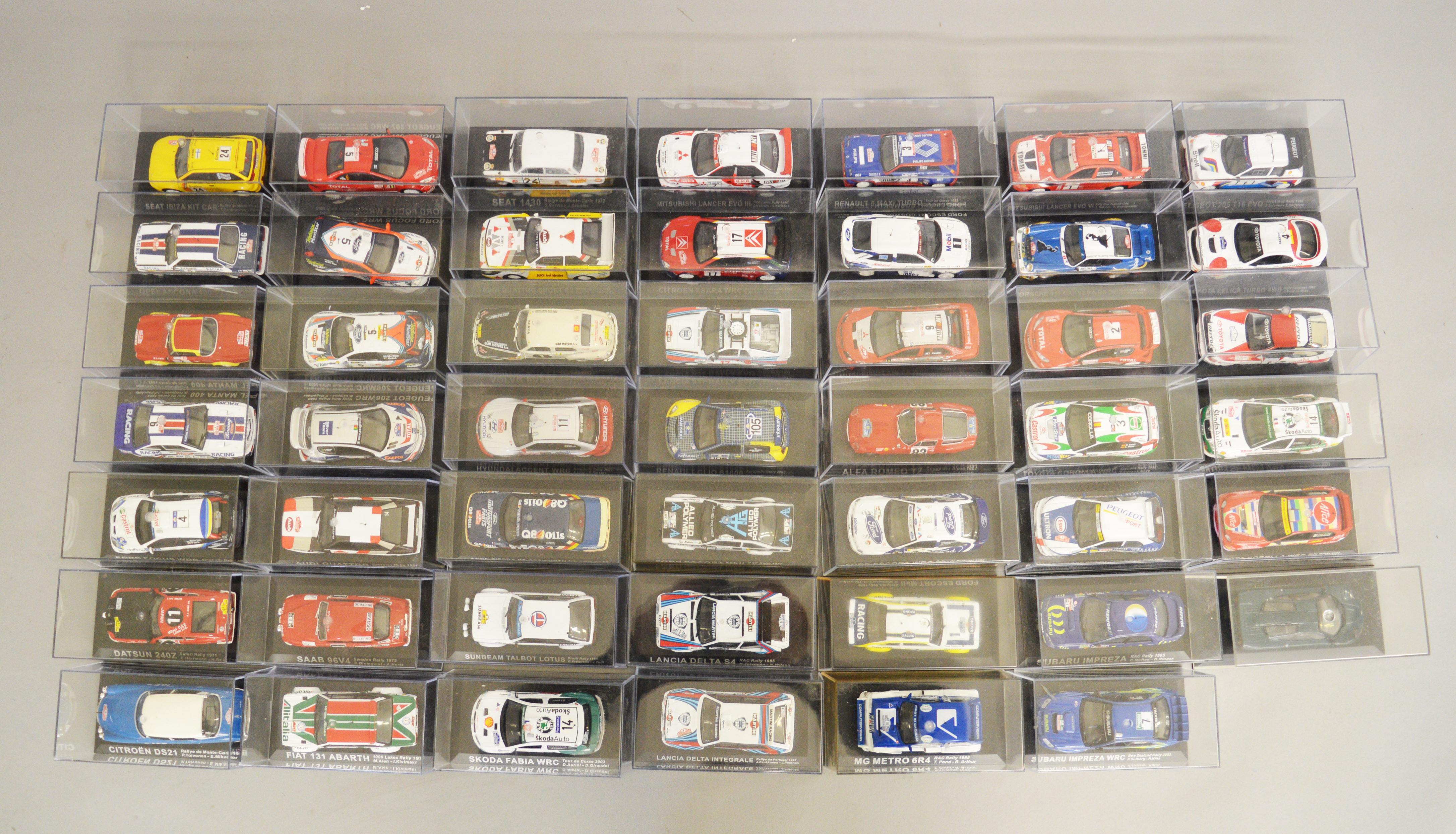 48 x 1:43 scale model racing cars from a partwork series, boxed and VG.