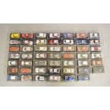 48 x 1:43 scale model racing cars from a partwork series, boxed and VG.