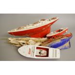 Four unboxed Tri-ang Scalex plastic bodied boats including a 24 inch Scalex Yacht.