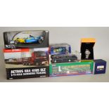 A selection of boxed diecast models including two 1:50 scale trucks,