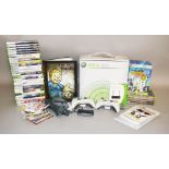 Xbox 360: 20 games, Scene It, Fallout book, two controllers and wireless adaptor.