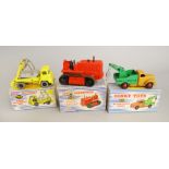 Three boxed Dinky Toys diecast models including 963 Heavy Tractor,
