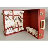 A Brexton (England) picnic set, containing cutlery and crockery with a floral design,