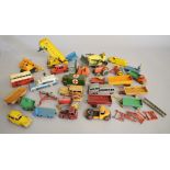 Twenty five unboxed Dinky Toys diecast models with varying degrees of play wear,