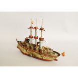 An unboxed vintage tinplate clockwork Battleship model, although unmarked as such,
