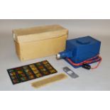 A boxed mains operated metal film strip projector,