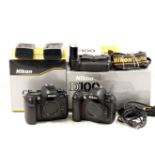 Two Nikon D100 Pro Digital Cameras. D100 #2110540 (condition 5E) in maker's box.