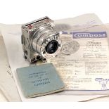 INCREASED ESTIMATE. Compass Camera By Le Coultre Co. #2719. (Condition 5F).