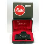 Black Leica R4 Body #1541122 (condition 5F). In presentation box with outer sleeve.