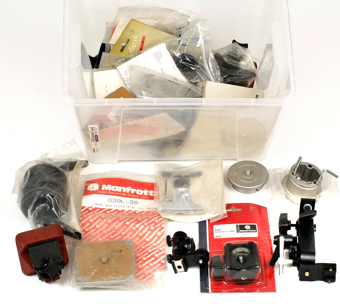 Box of Manfrotto Tripod & Stand accessories. Ex shop stock, many in original packaging. HEAVY.