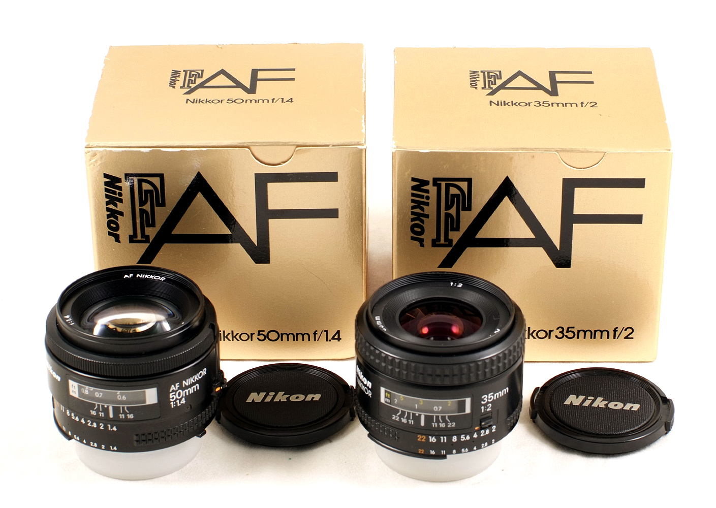 Two Boxed Nikon Auto Focus Lenses. Nikkor 50mm f1.