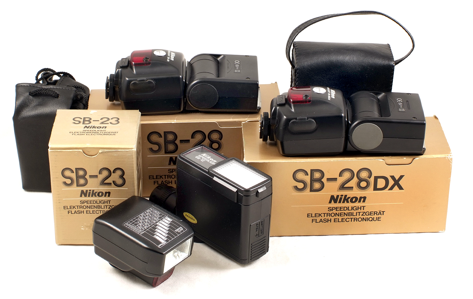 Four Nikon SB Flash Units. Comprising SB12, SB23, SB28 and SB28DX (condition 5F).