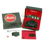 Black Leica R4s Body. #1653491 (condition 5F). With strap.