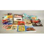 Nine boxed Tinplate models, including both friction and clockwork powered examples,