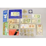 A boxed quantity of notes & coins to include uncirculated pack, commemorative packs,