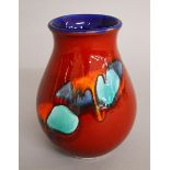 A Poole pottery Delphis style vase. Height 17cm.