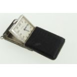 A Vertex 1930's silver leather covered manual-wind purse watch, with undamaged silvered dial,