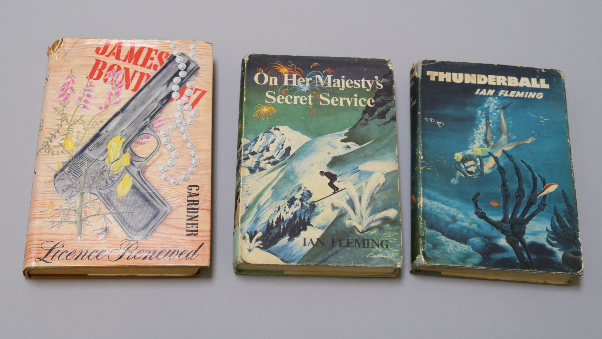 Three hardback James Bond books - Thunderball by Ian Fleming book club edition with dust jacket