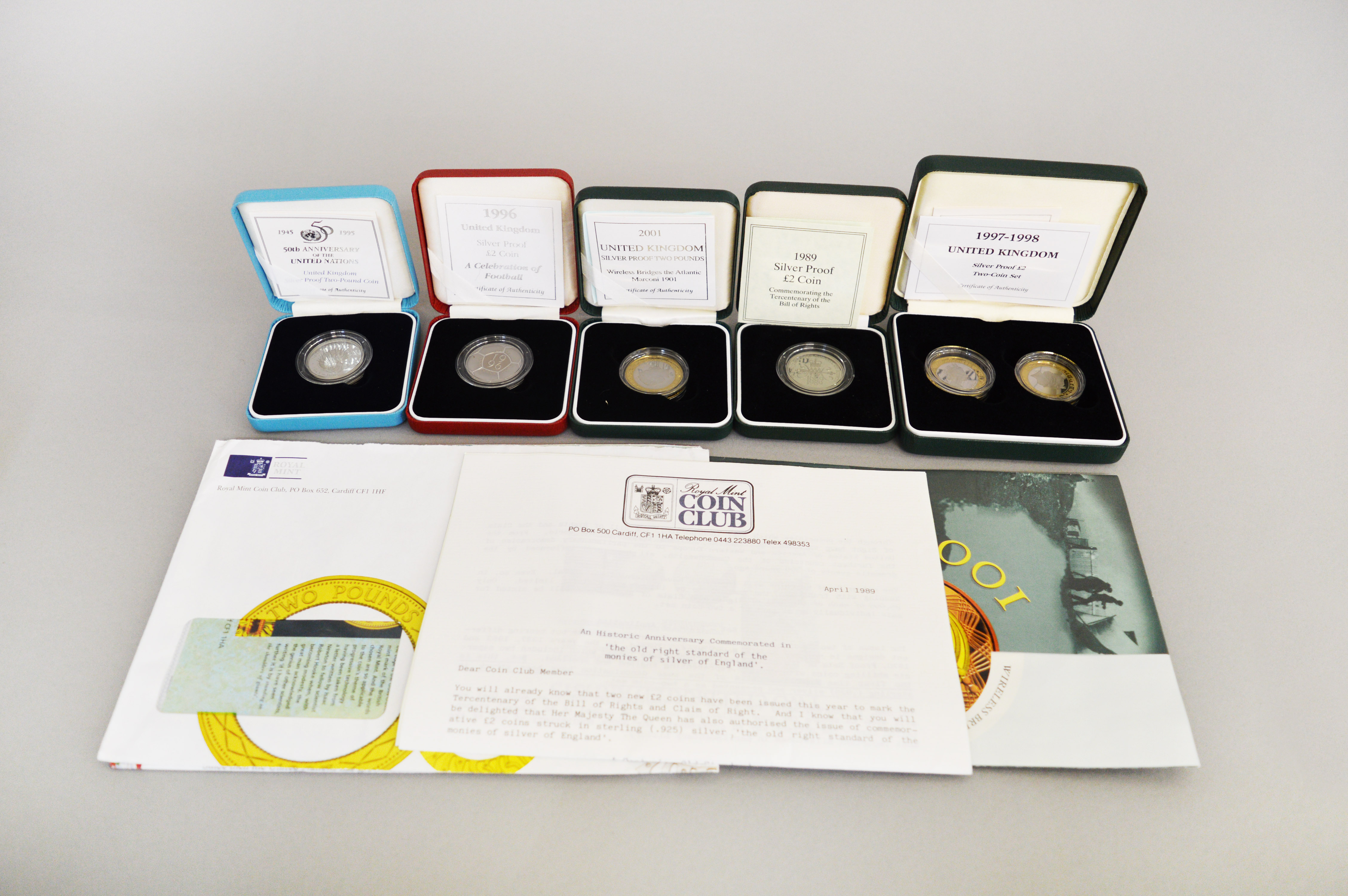 Seven Royal Mint proof boxed two pound silver coins to include 50th Anniversary of the United