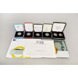 Seven Royal Mint proof boxed two pound silver coins to include 50th Anniversary of the United