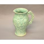 Arthur Woods Art Deco jug with embossed flower design. Height 20cm.