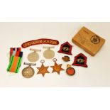 A small military lot to include, Grenadier Guards shoulder titles, formation badges,