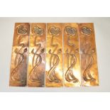 Five Art Nouveau copper door finger-plates.