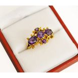 A 9ct H/M yellow gold Amethyst set cluster ring, Makers mark "AC.Co".