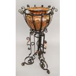 An Art Nouveau or Arts & Crafts wrought-iron Jardiniere with copper leaf details and copper