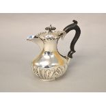 A Silver water jug H/M Chester 1903 with fluted decoration, height approx 15.