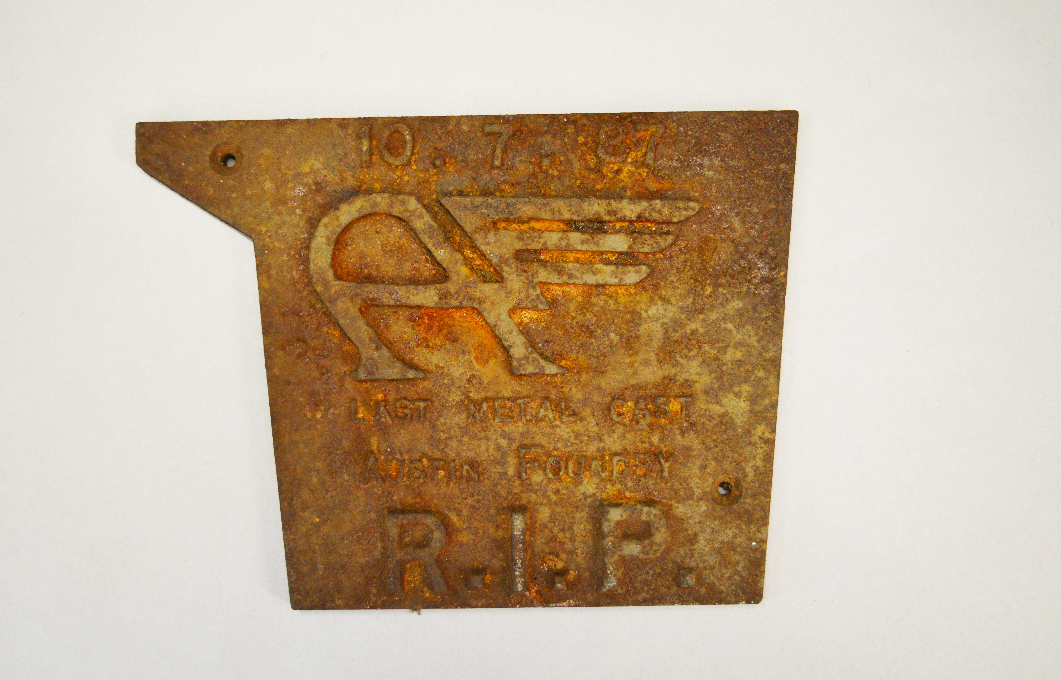 A metal cast plaque for the closure of the Austin Foundry - " 10.7.