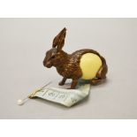 A tape measure in the form of a gilt-metal rabbit. Tail winds to retract tape. Height 5cm approx.