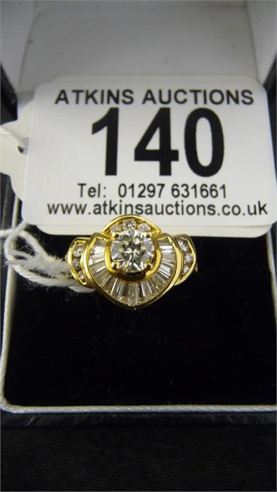 A fancy middle eastern style diamond ( 32) set cluster ring, with a central round brilliant cut