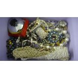A quantity of costume jewellery including Swarovski, a large Celtic "Cairngorn" type brooch etc.