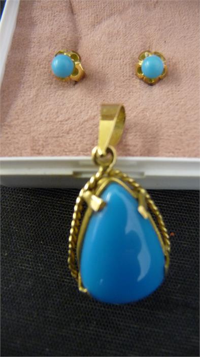 A Turquoise pendant set in Continental gold mount along with similar pair of earrings set in 18ct