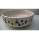 A Poole pottery bowl commissioned by John Waddington Ltd depicting playing card suits