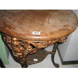 A cast iron Brittania pub table with circular top