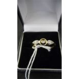 A pretty Art Deco ring in 18ct gold set with 3 diamonds