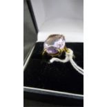 An 18ct gold ring set with a pale amethyst