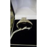 A diamond ring set with 16 stones ( 0.5 ct) set in 18ct white gold