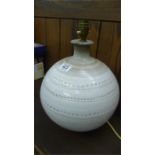 A glazed pottery lamp base