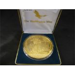 A giant half pound "Golden Eagle" proof coin by the Washington Mint- Pure Silver which is layered